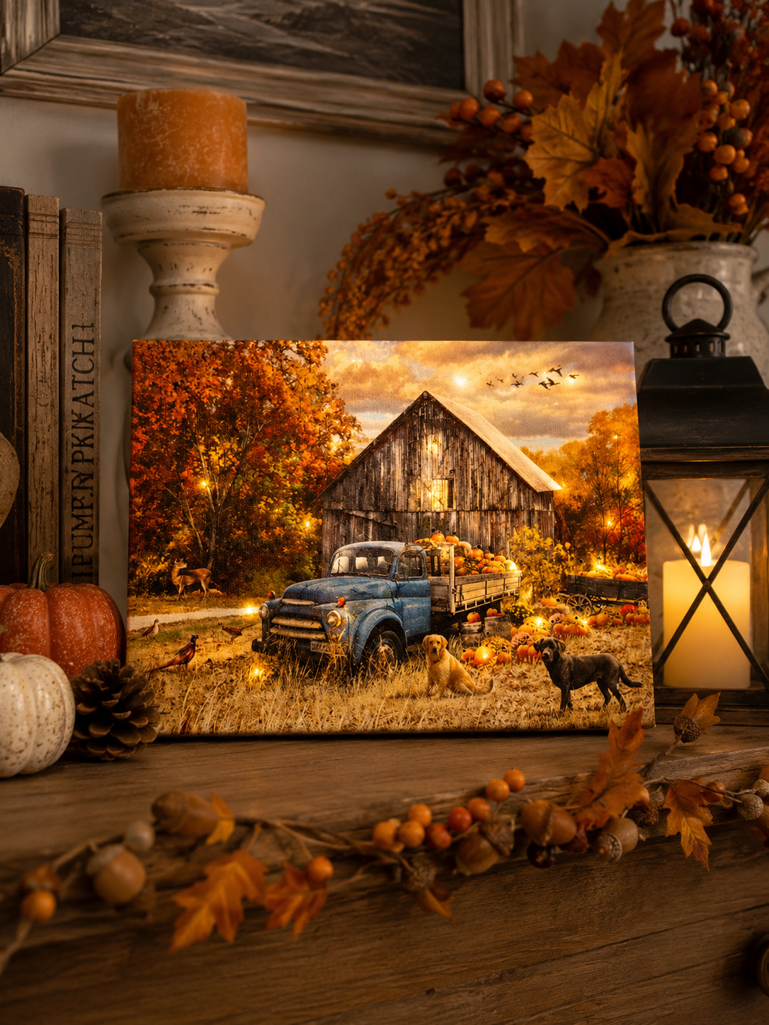 Light-up fall tabletop canvas featuring a rustic barn and vintage blue truck, styled with pumpkins, autumn leaves, florals, and lantern decor.