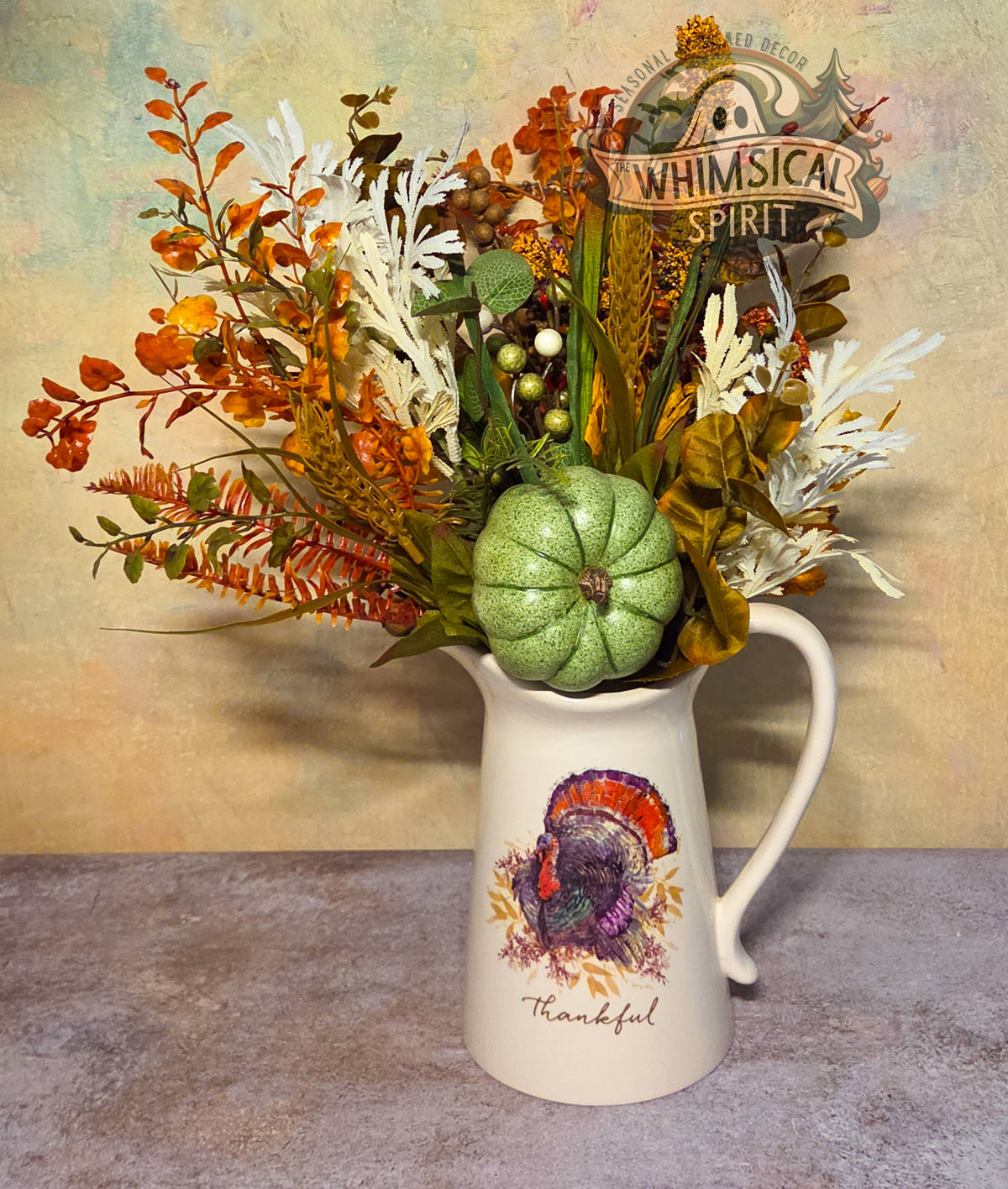 Full view of A Grateful Gathering in a white turkey pitcher with “Thankful” lettering and a green pumpkin.