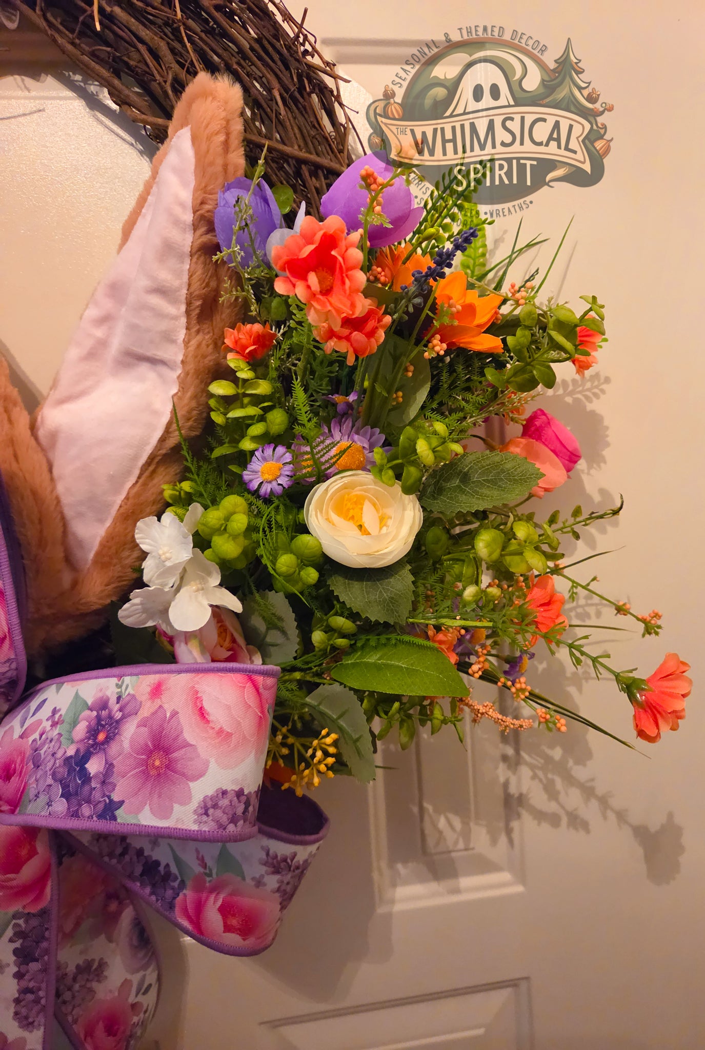 Colorful floral arrangement with a decorative sign in the background