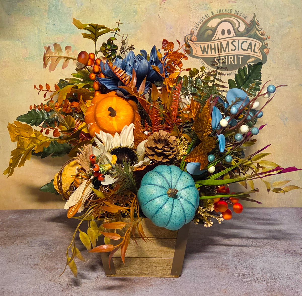 Full view of Blue Pumpkin Daydream, a fall centerpiece in a rectangular wooden planter with pumpkins, flowers, and autumn foliage.