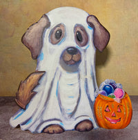 Front view of a white ghost dog metal decoration with brown ears and tail beside an orange pumpkin bucket filled with colorful candy.