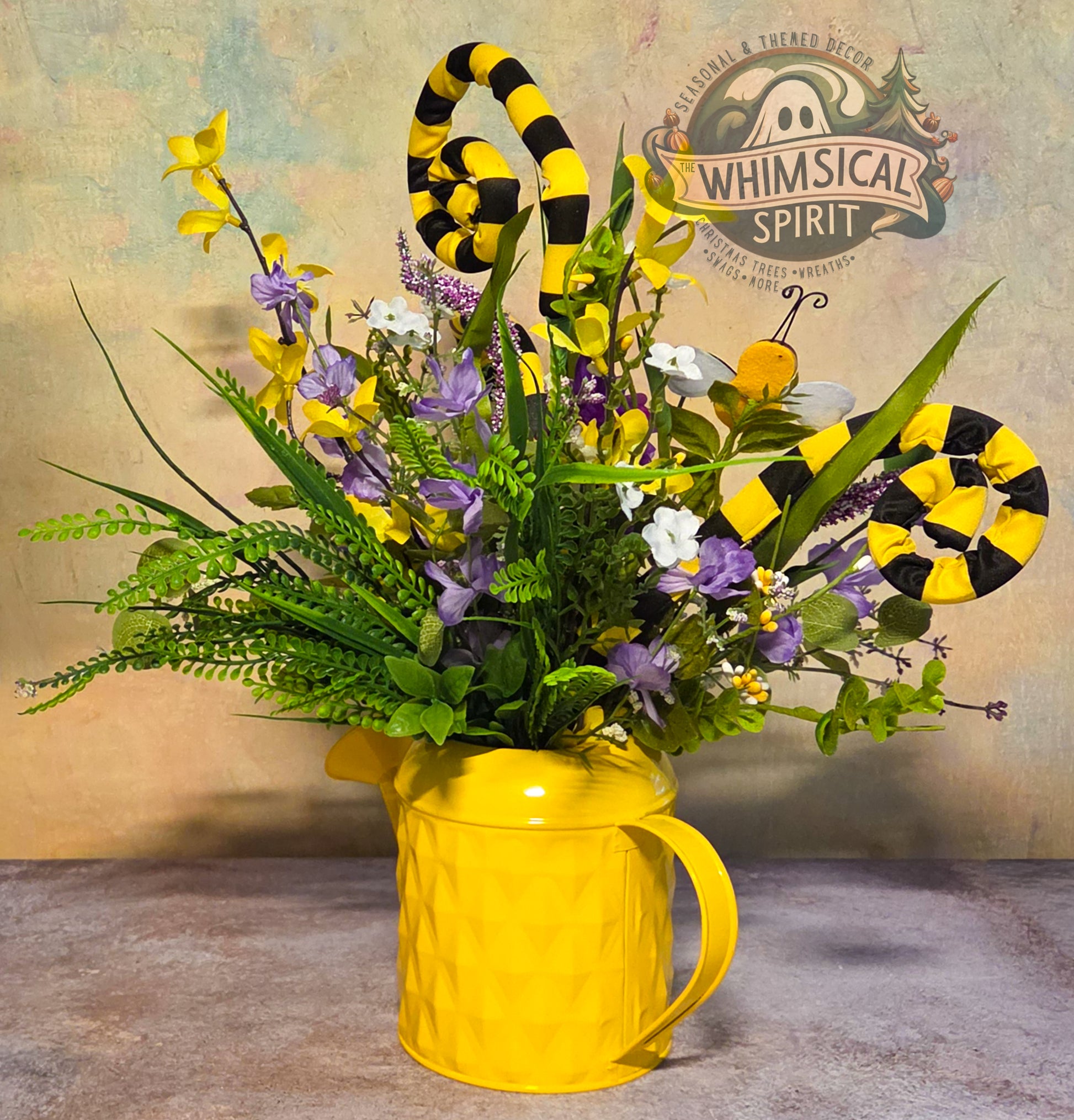 Yellow mug with floral arrangement and snake decorations against a rustic background with 'Whimsical Spirit' branding.