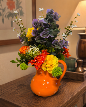 Handmade centerpiece with vibrant spring & summer florals, and seasonal tabletop decor by The Whimsical Spirit