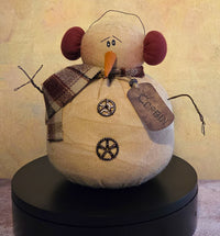 Corbin the Snowman winter soft sculpture shelf sitter with cozy earmuffs, plaid scarf, twig arms, carrot nose, button details, and name tag.