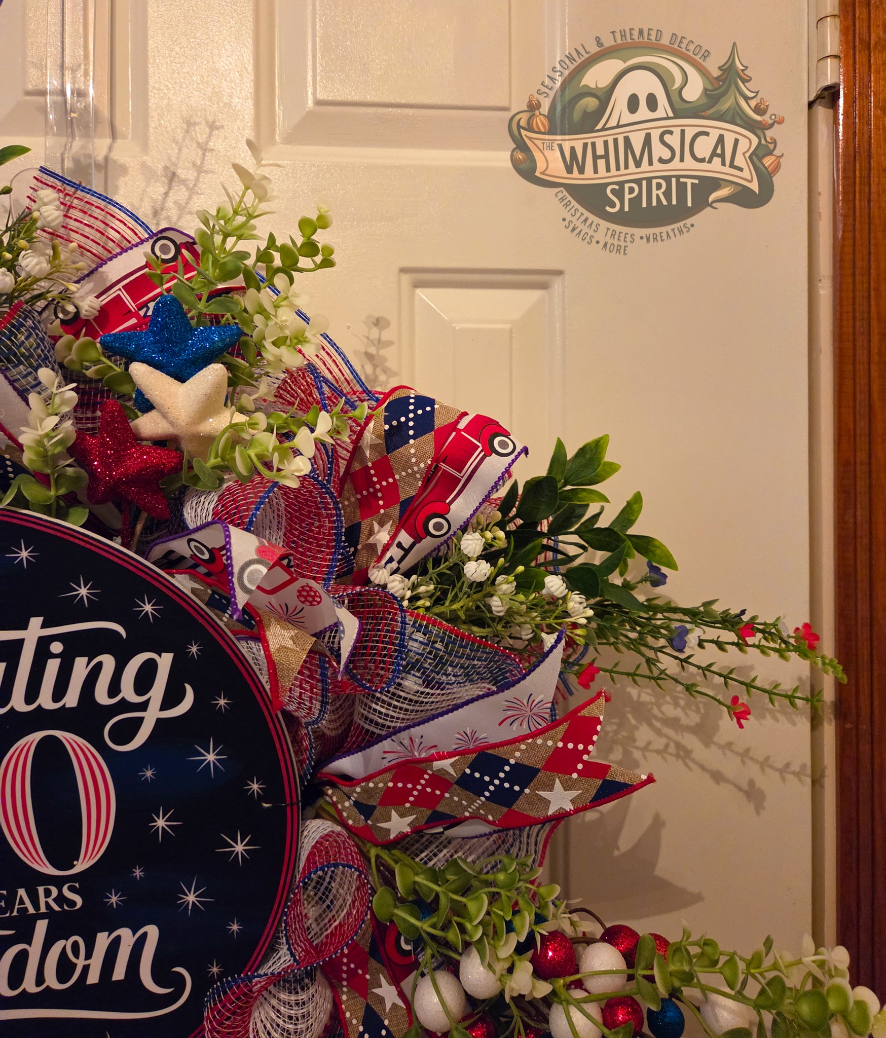 Decorative wreath with red, white, and blue ribbons and flowers, featuring a 'Whimsical Spirit' logo.