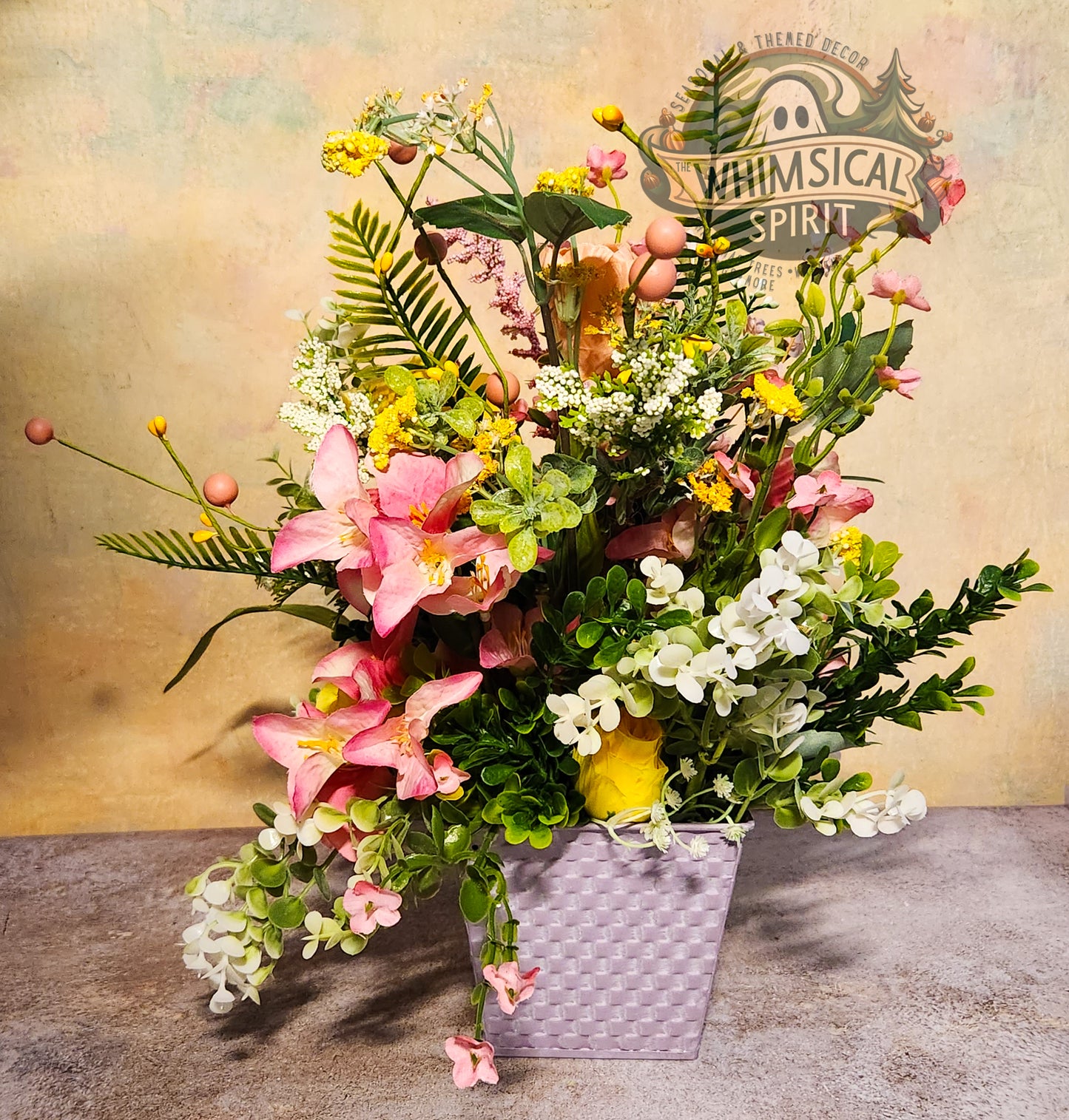 Colorful floral arrangement with a 'Whimsical Spirit' sign in the background