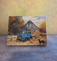 Harvest Day light-up fall tabletop canvas featuring a blue truck, pumpkins, rustic barn, autumn trees, dogs, and cozy harvest scene.