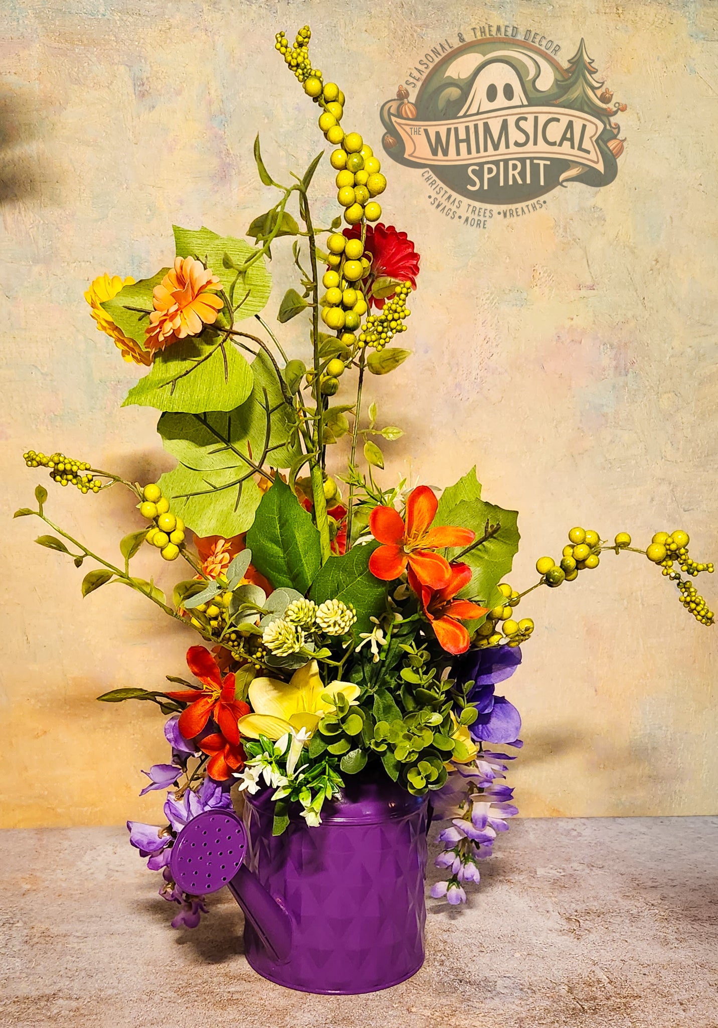 Colorful flower arrangement in a purple container with 'Whimsical Spirit' branding in the background.