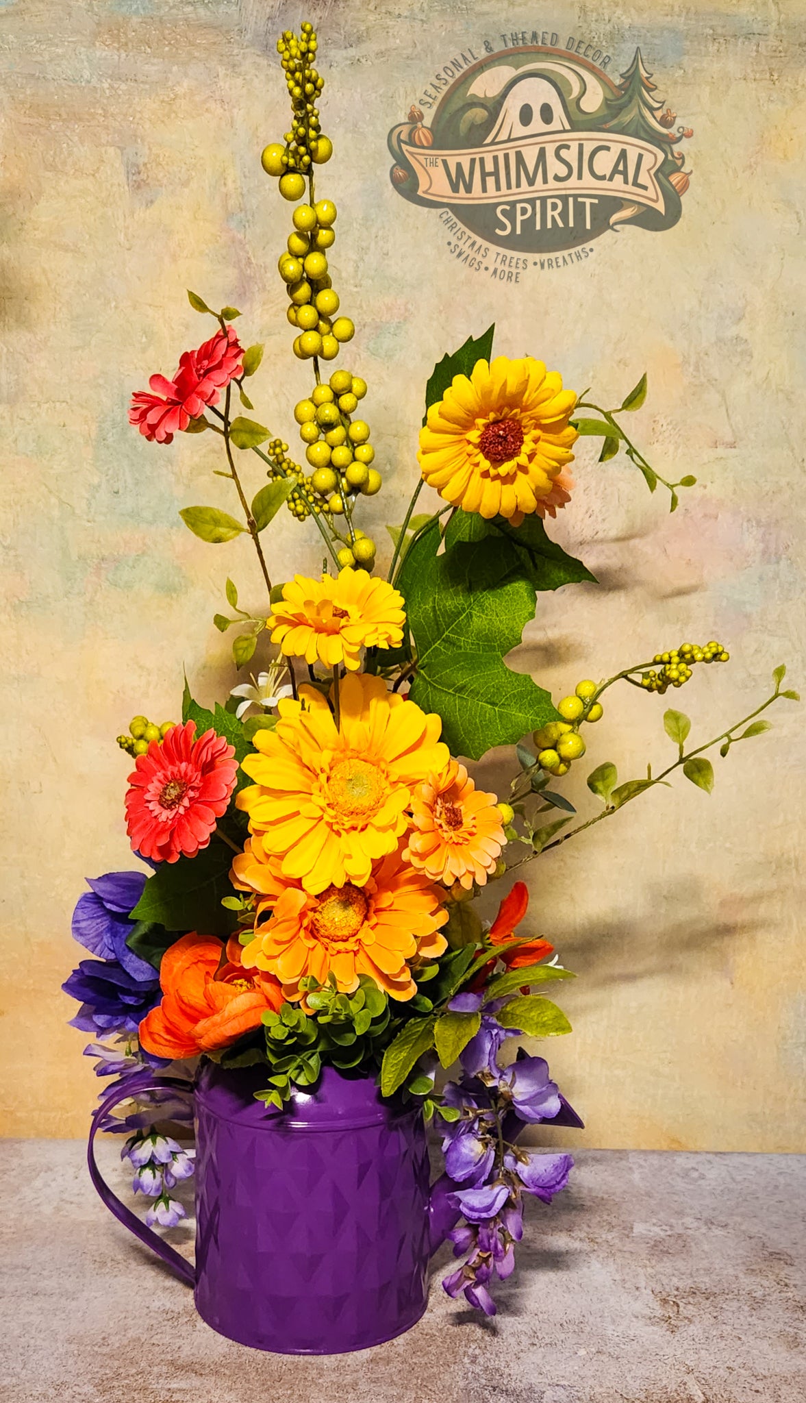 Colorful flower arrangement in a purple vase with 'Whimsical Spirit' branding in the background.