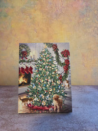 Merry and Bright light-up Christmas tabletop canvas featuring a decorated Christmas tree, fireplace, stockings, puppies, cats, and festive holiday decor.