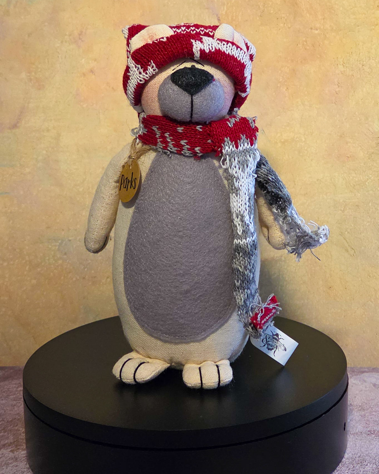 Parks the Polar Bear winter soft sculpture shelf sitter with red knit hat, red and gray scarf, gray belly, name tag, and cozy polar bear details.