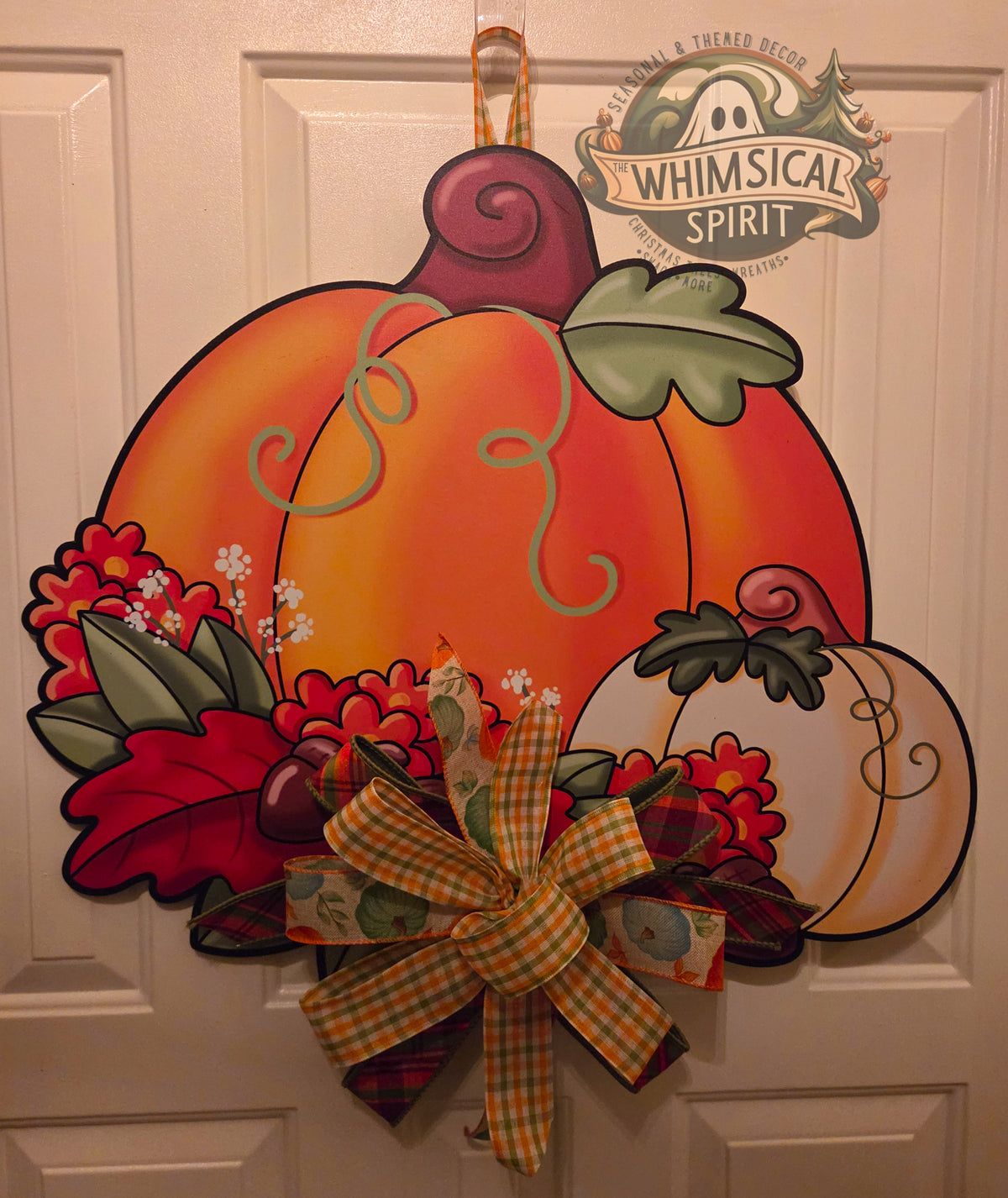 Petals in the Pumpkin Patch birch wood fall door hanger with orange and cream pumpkins, autumn flowers, and a plaid bow