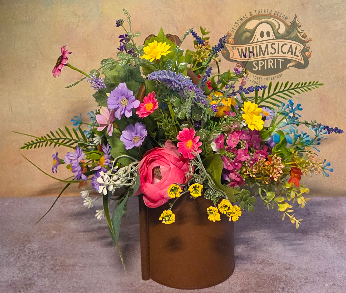 Colorful bouquet of flowers in a vase with 'Whimsical Spirit' branding in the background.
