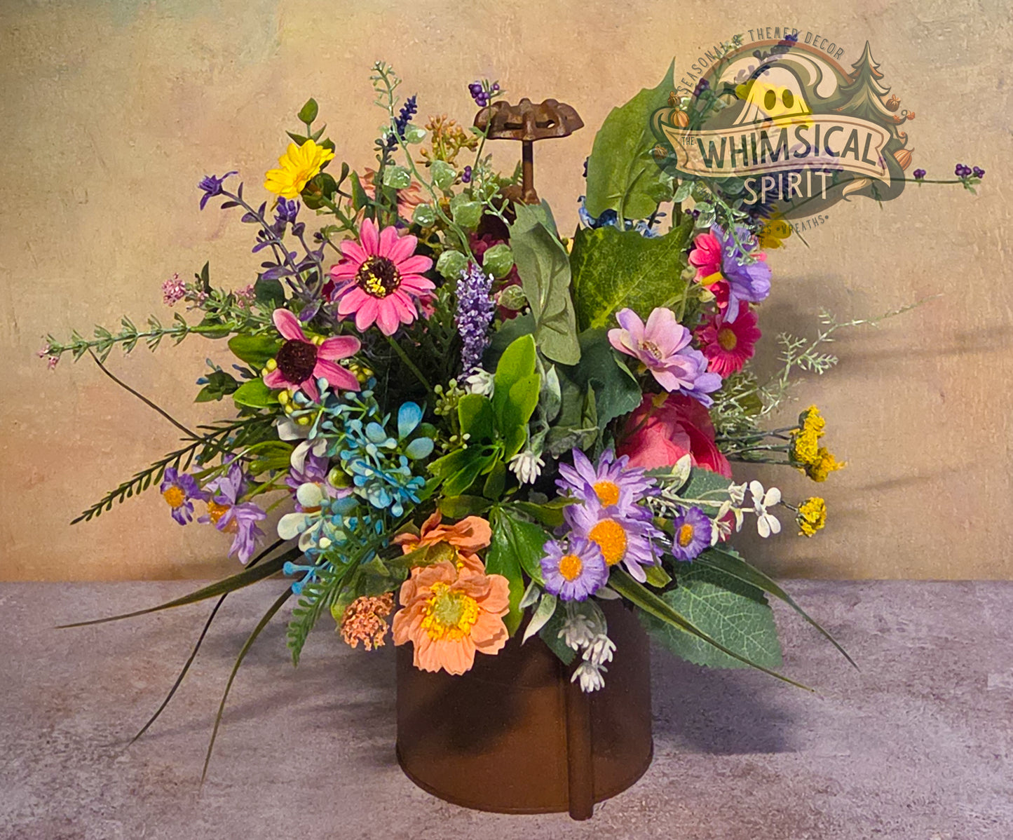 Colorful flower arrangement in a brown vase with 'Whimsical Spirit' logo in the background.