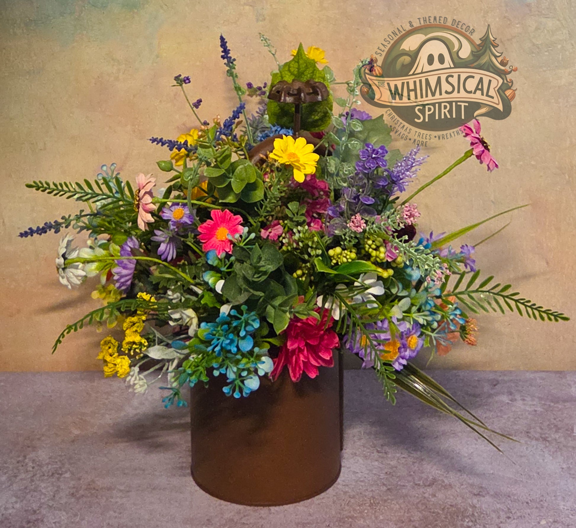 Colorful flower arrangement in a brown vase with 'Whimsical Spirit' logo in the background.