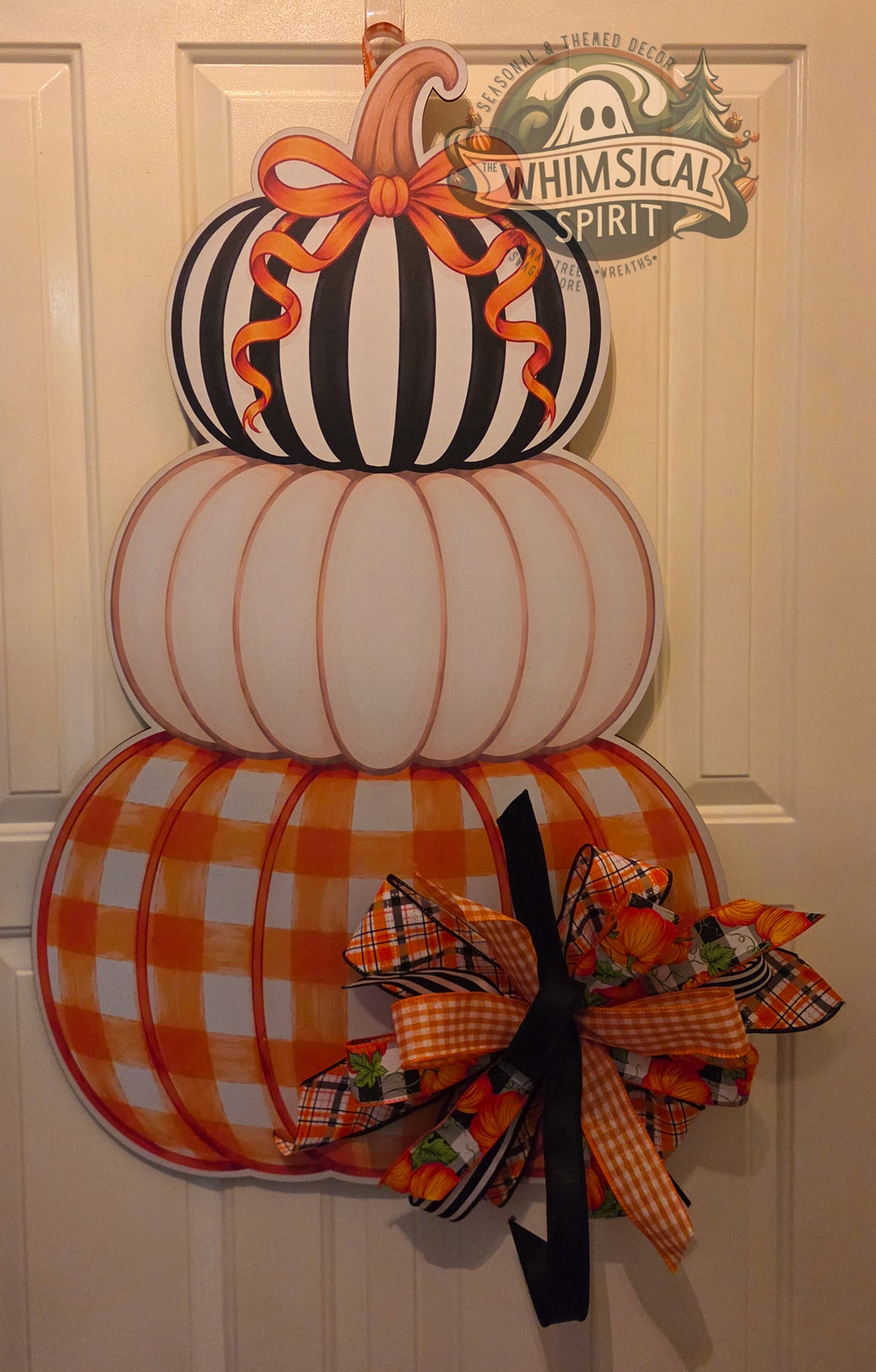 Plaid, Pinstripes & Pumpkins birch wood fall door hanger with three stacked pumpkins and a large mixed-pattern autumn bow