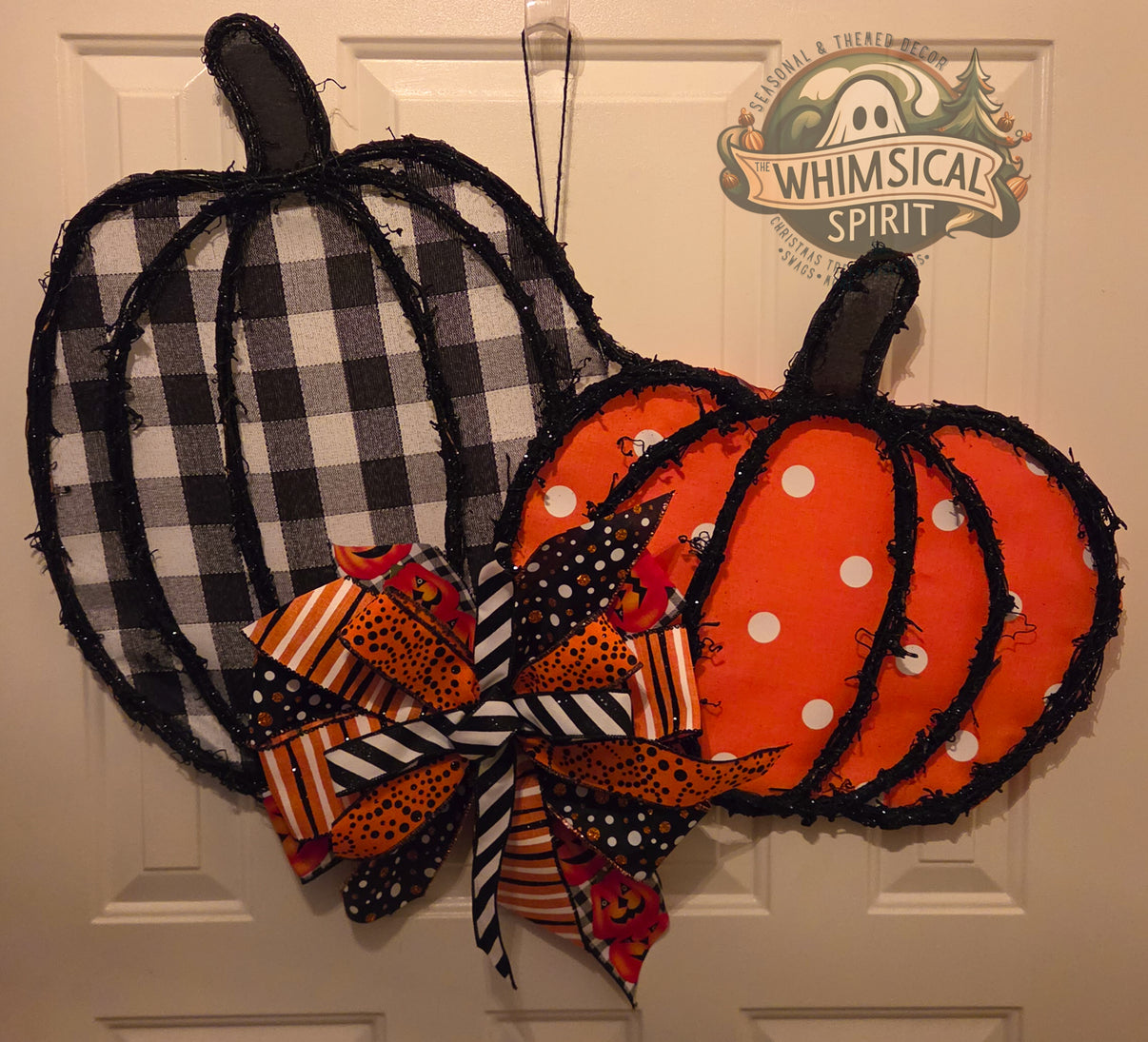 Halloween and fall double pumpkin door hanger with black plaid pumpkin, orange polka dot pumpkin, and layered Halloween bow.
