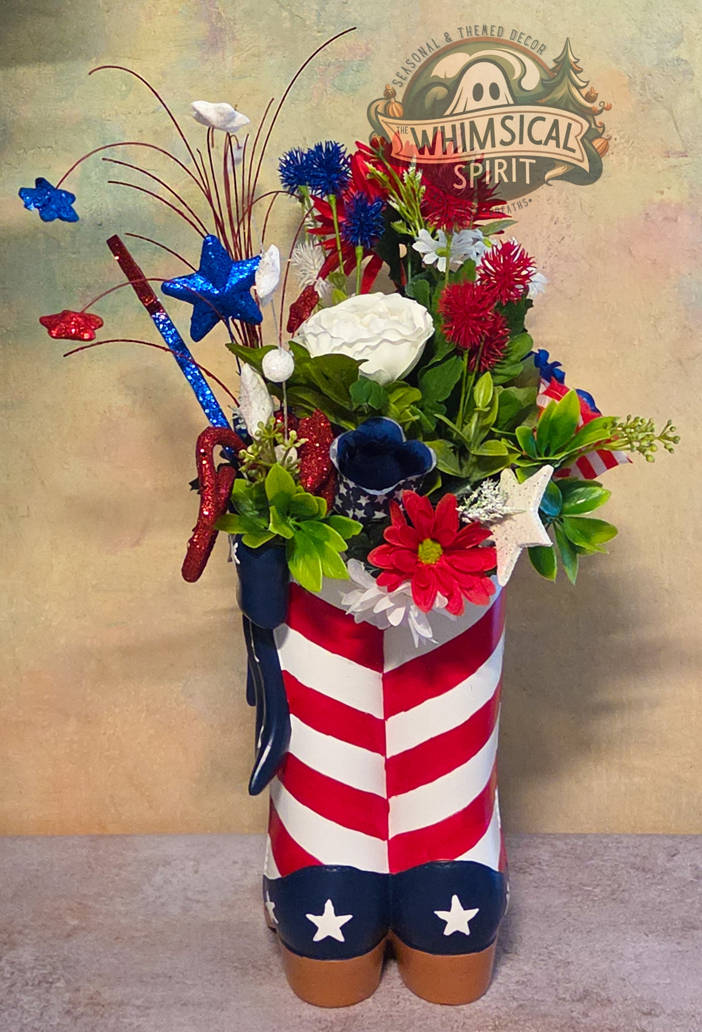 Floral arrangement in a boot with American flag design, featuring the brand 'Whimsical Spirit'.