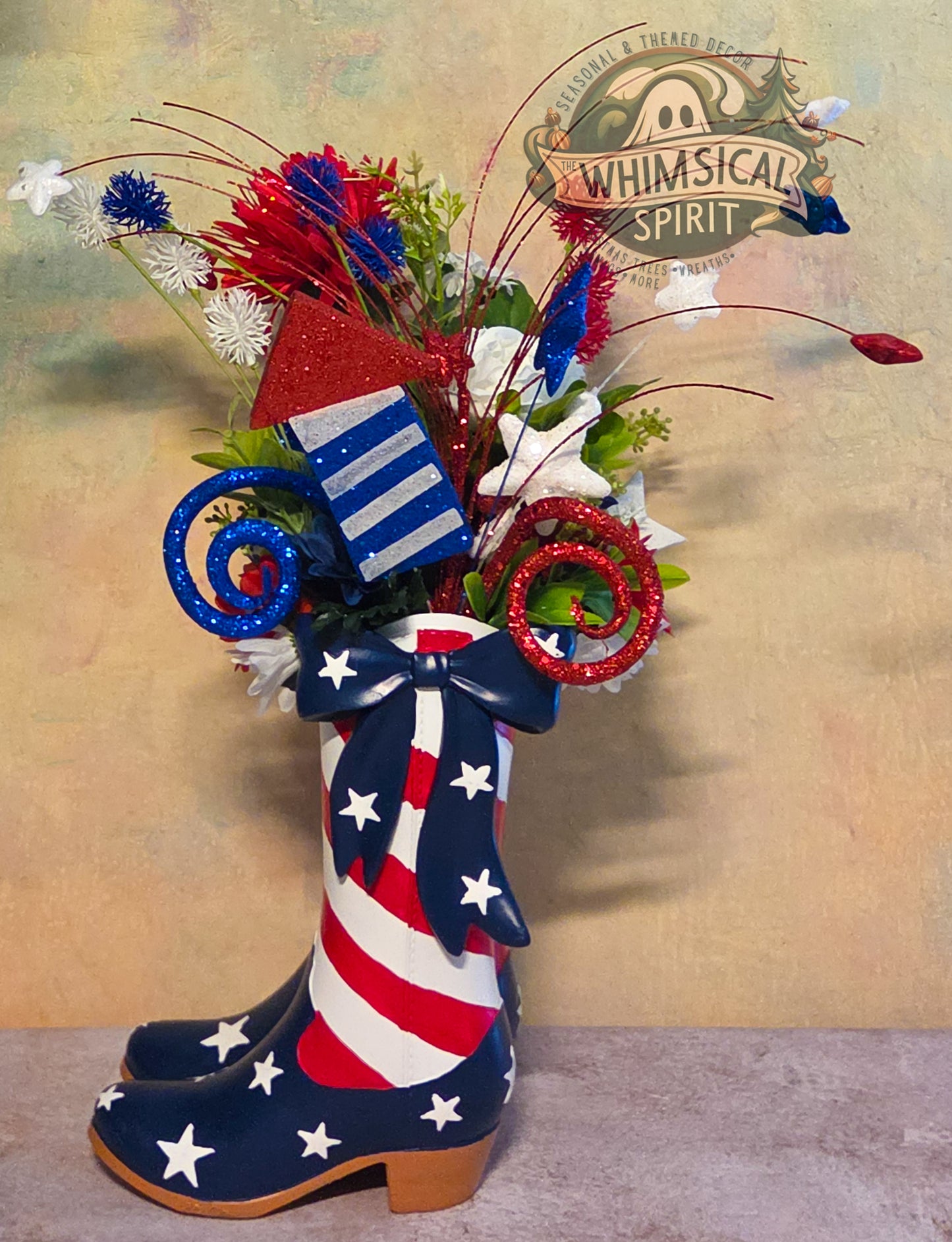 Decorative flower arrangement in a boot with American flag design, featuring the brand 'Whimsical Spirit'.
