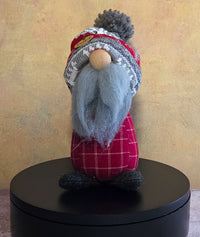 Runt the Gnome winter soft sculpture shelf sitter with gray beard, red plaid body, cozy patterned hat, dark feet, and name tag.