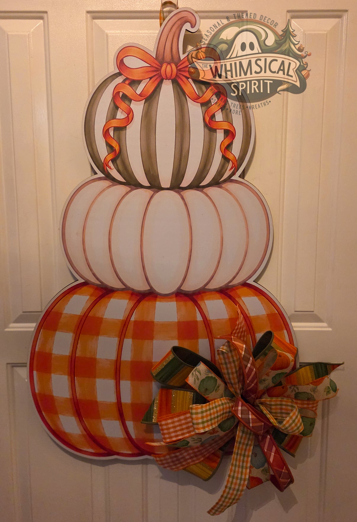 Sage, Spice & Everything Plaid birch wood fall door hanger with three stacked pumpkins and a large earthy autumn bow
