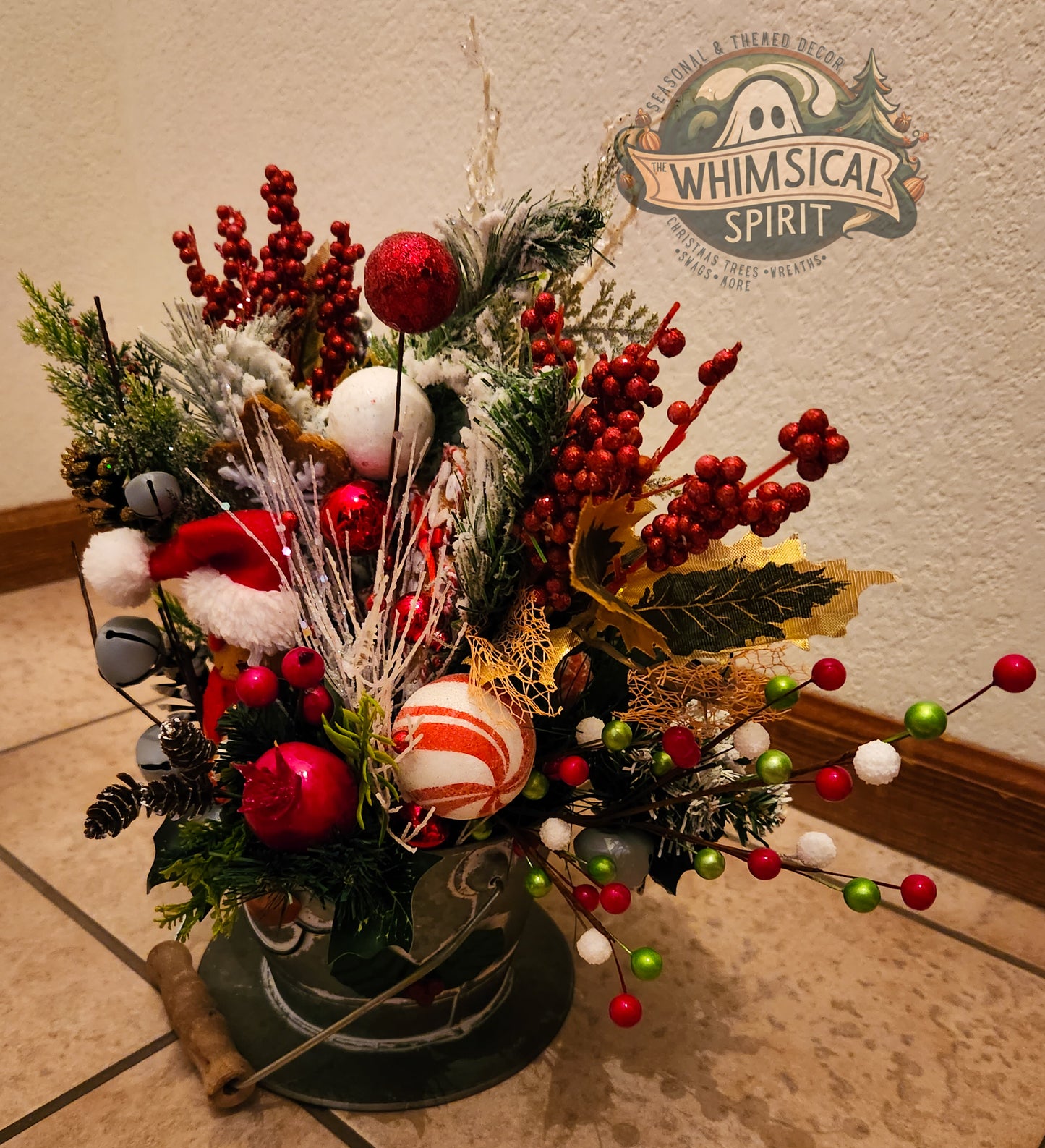 Decorative Christmas arrangement featuring red berries, candy canes, and pinecones
