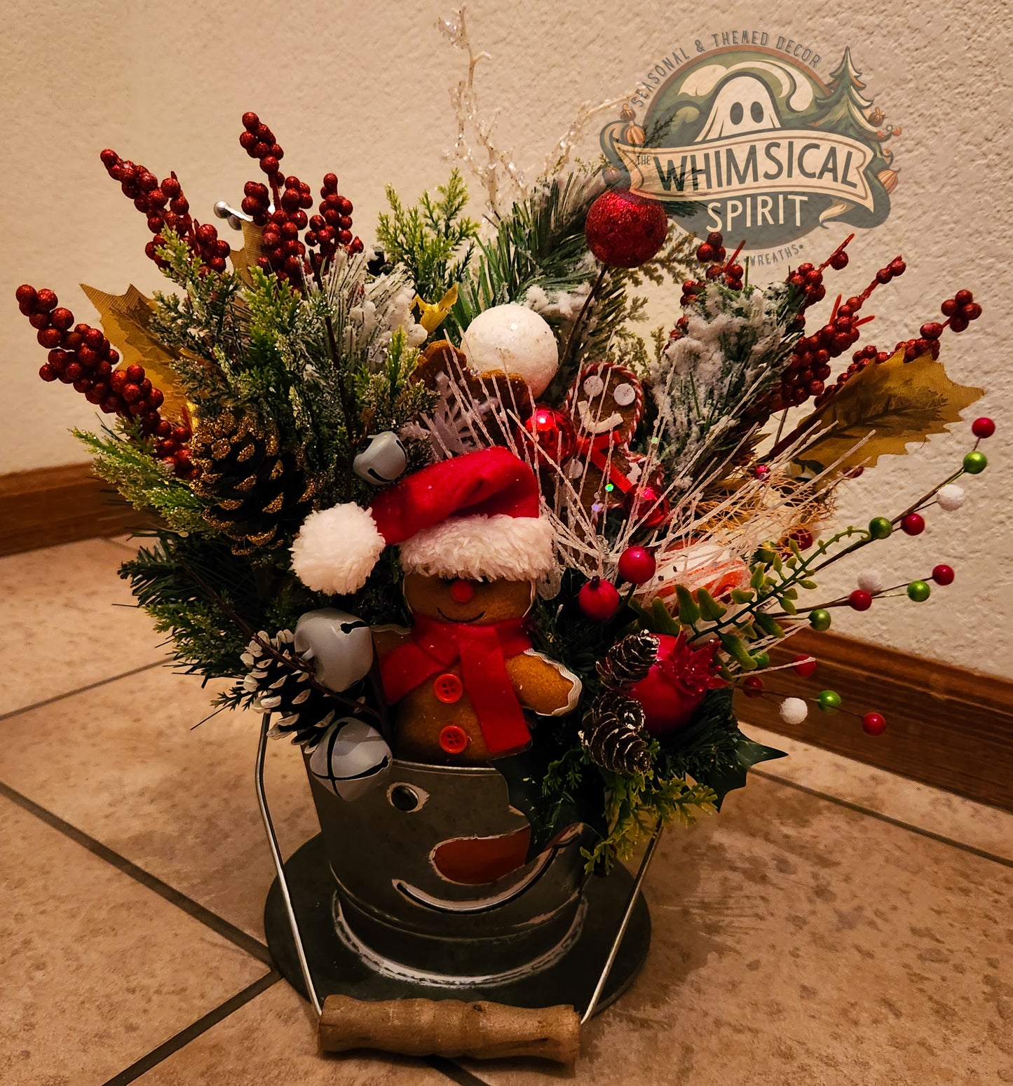 Decorative floral arrangement with a figurine wearing a Santa hat.