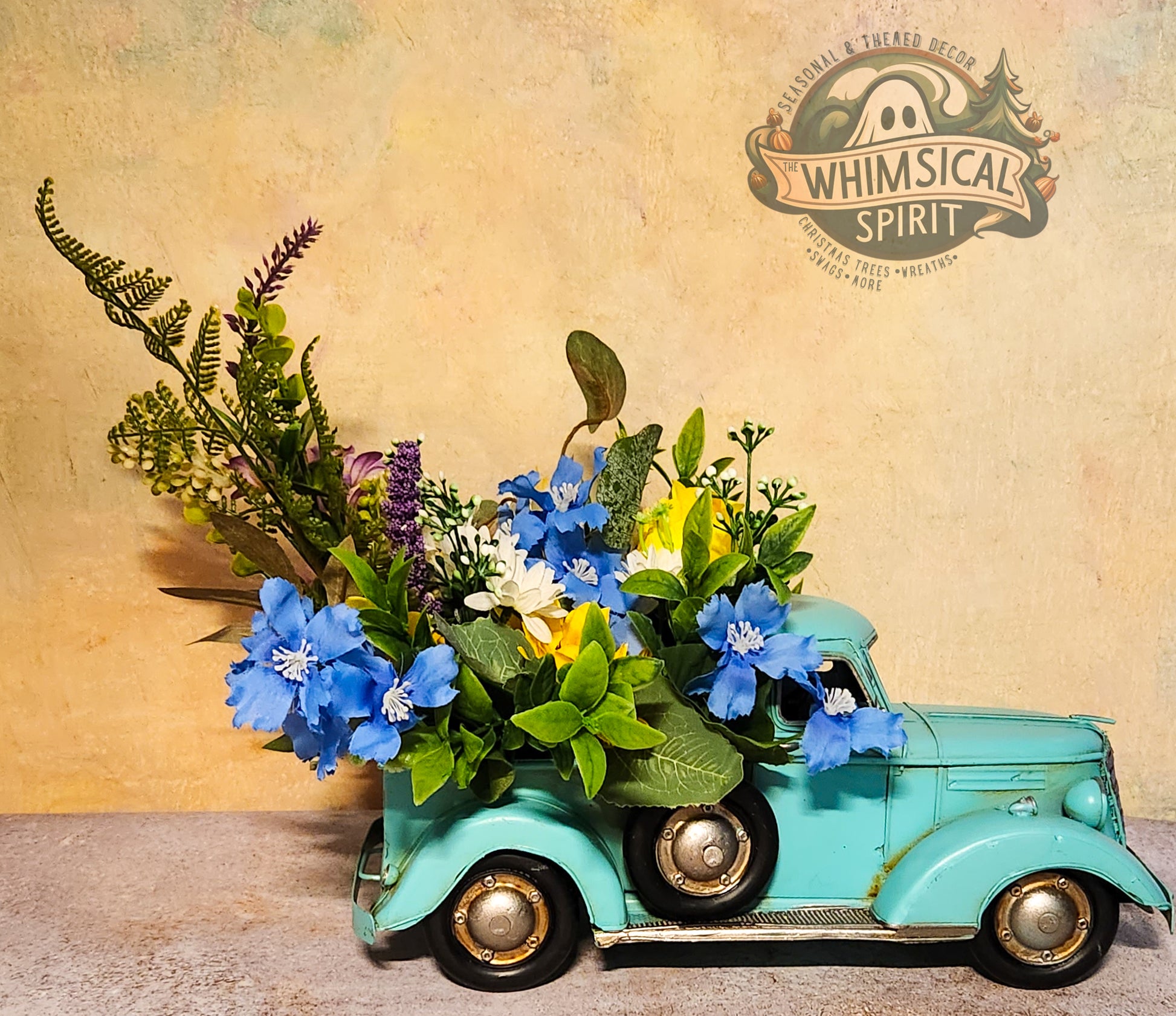 Vintage toy truck with flowers against a textured background with 'Whimsical Spirit' branding.