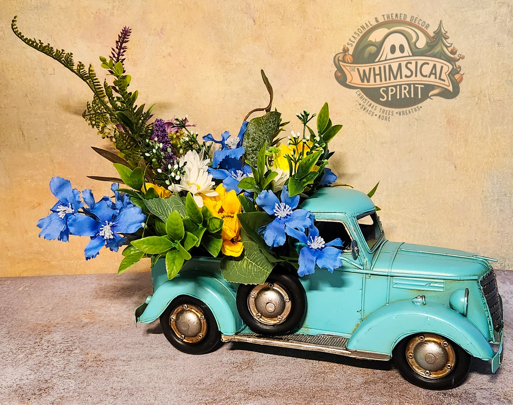 Vintage-style toy truck with floral arrangement against a rustic background with 'Whimsical Spirit' branding.