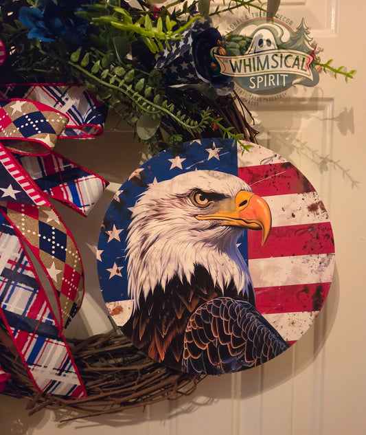 Decorative wreath with an eagle design on a door, featuring the brand 'Whimsical Spirit'.