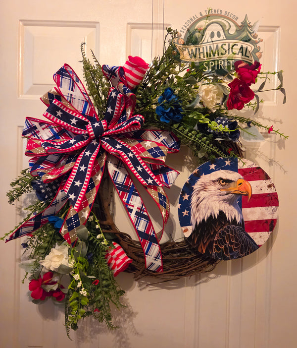 Decorative wreath with American flag elements and 'Whimsical Spirit' branding on a door.