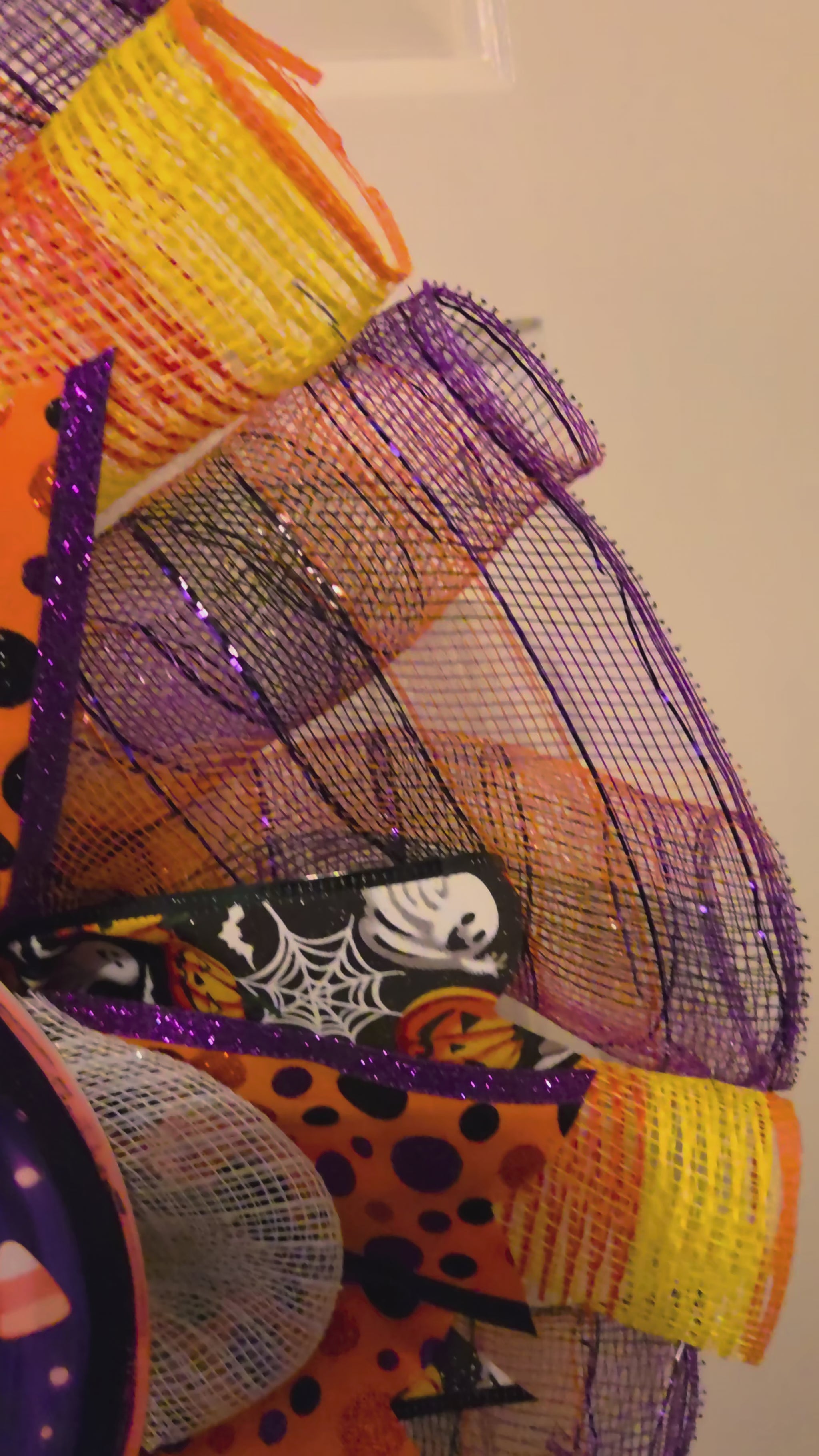 Video tour of the Candy Corn Commotion wreath showing the ghost BOO! sign, layered mesh, and Halloween ribbon details.