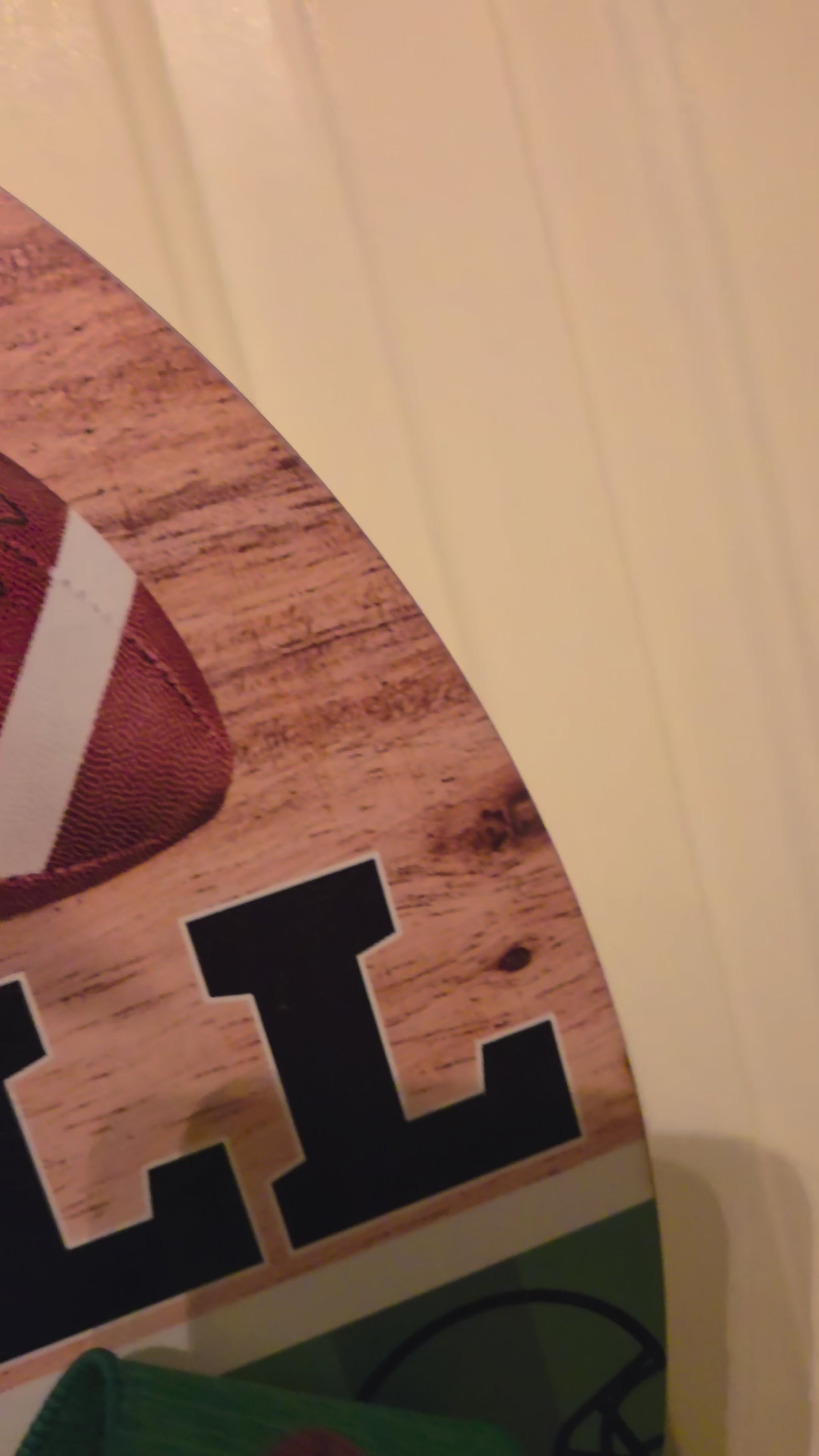 Video showing the Autumn Kickoff football door hanger, its birch wood design, layered game-day bow, ribbon loop, and dimensional details.