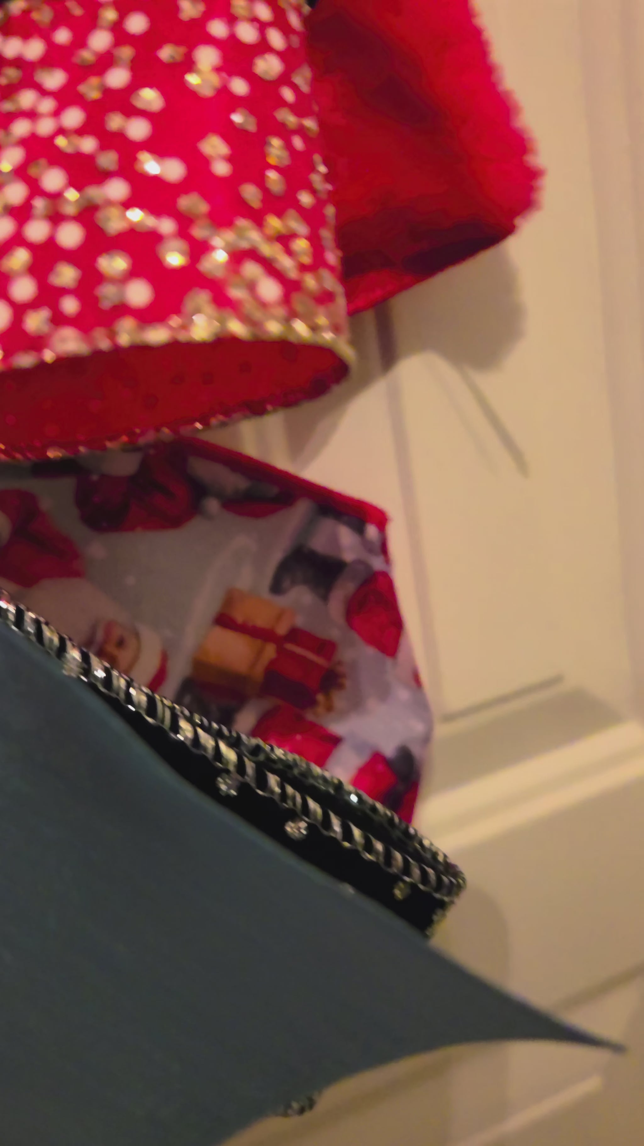 Video showing the details of the Midnight Snowfall Santa Christmas door hanger, including the snowy Santa artwork and layered holiday bow.