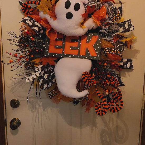 Video of Phantom Peek Halloween Wreath with Ghost and the word eek on it