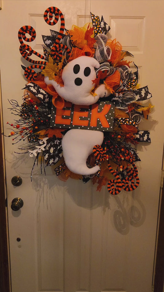 Video of Phantom Peek Halloween Wreath with Ghost and the word eek on it