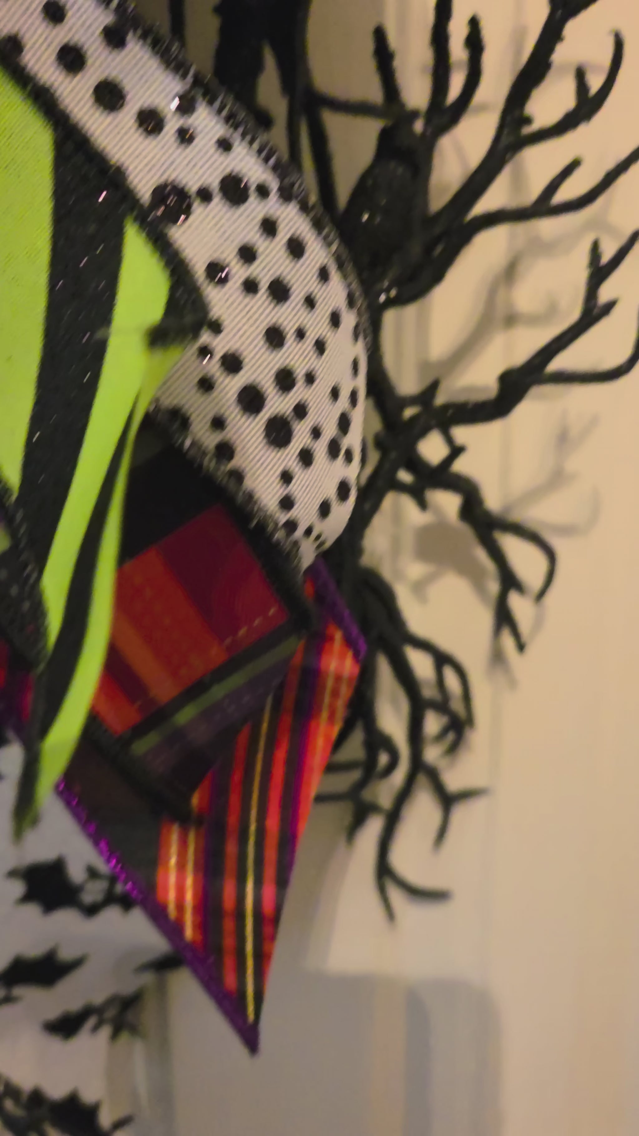 Video showing the Bats & Stripes Halloween wreath, black branch base, and layered oversized bow from multiple angles.