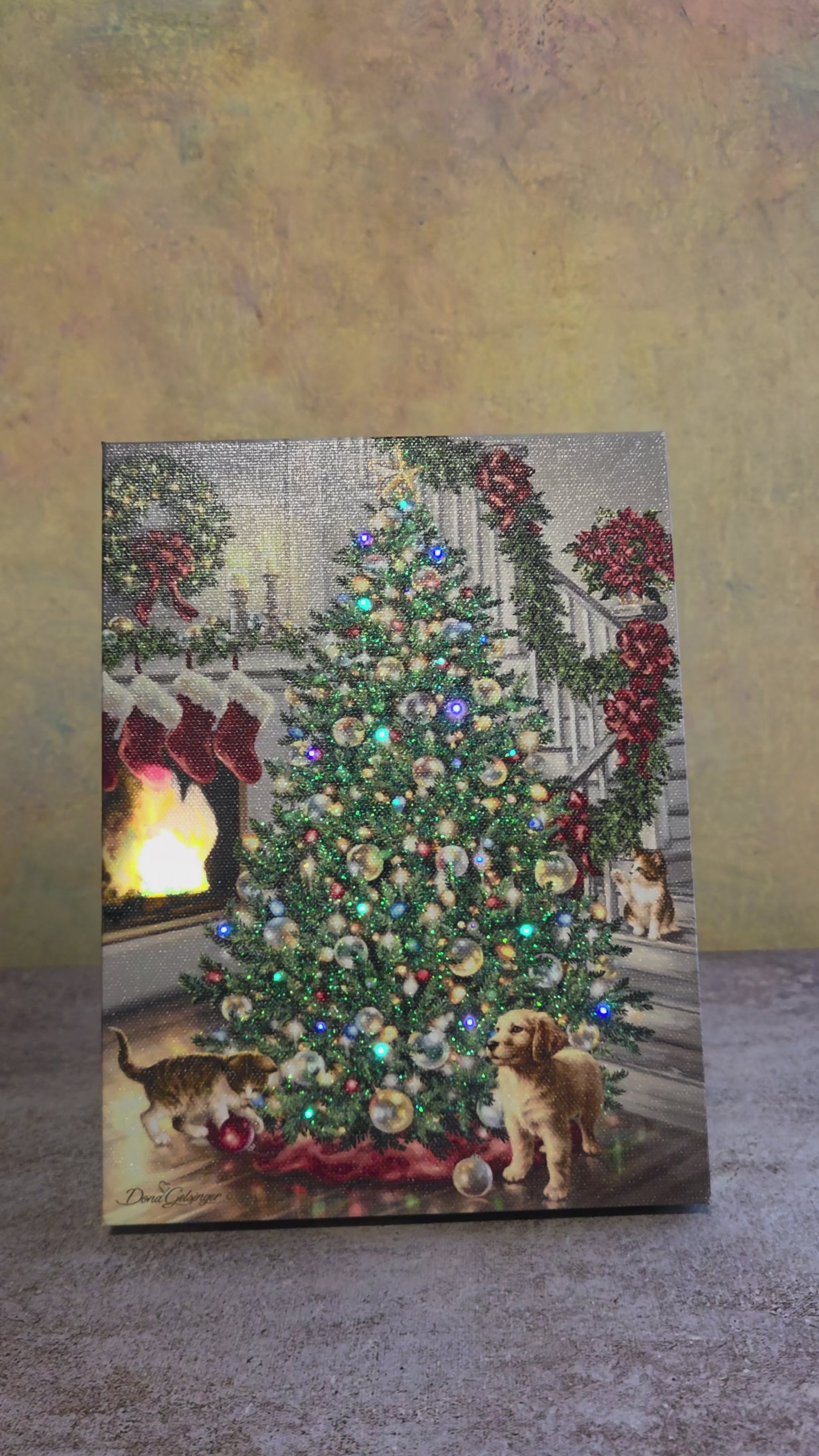 Video showing the light-up function on Merry and Bright, a Christmas tabletop canvas featuring a decorated tree, cozy fireplace, stockings, puppies, cats, and glowing holiday details.