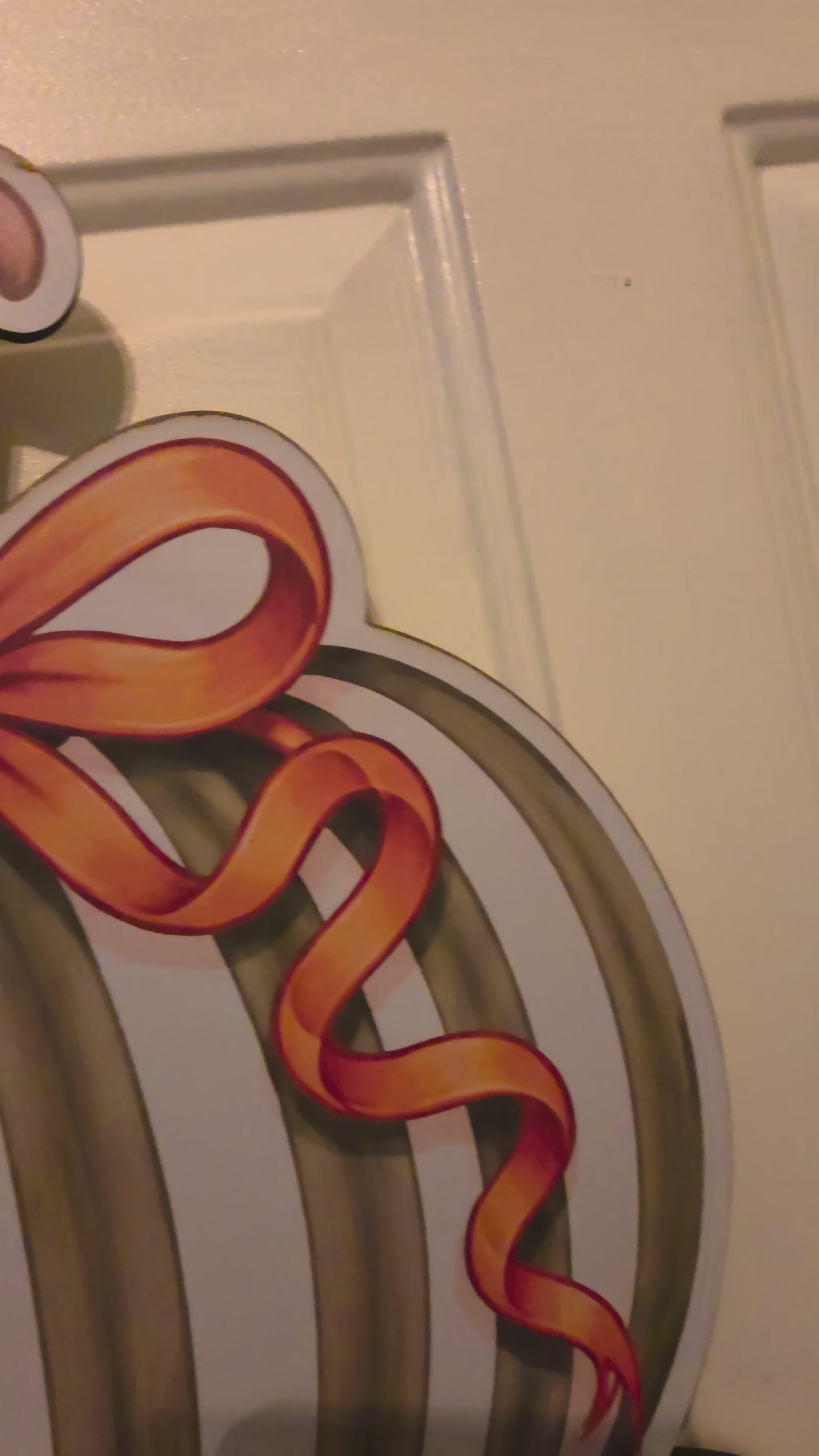 Video showing the full Sage, Spice & Everything Plaid stacked pumpkin birch wood door hanger and handcrafted fall bow
