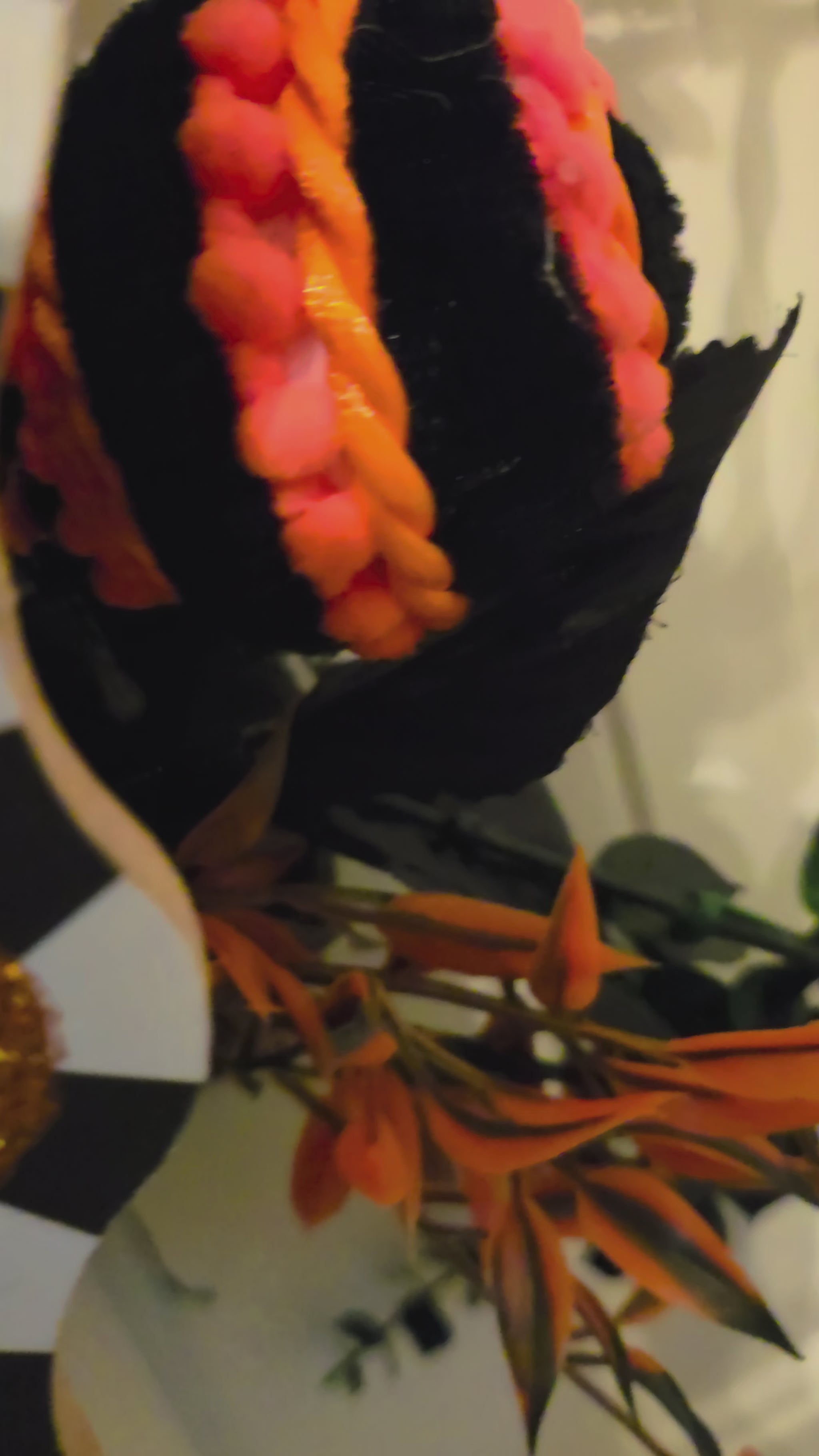 Video showcasing the complete Bones at the Door wreath and close-up details of its skeleton, sign, ribbons, pumpkins, foliage, and spooky accents.