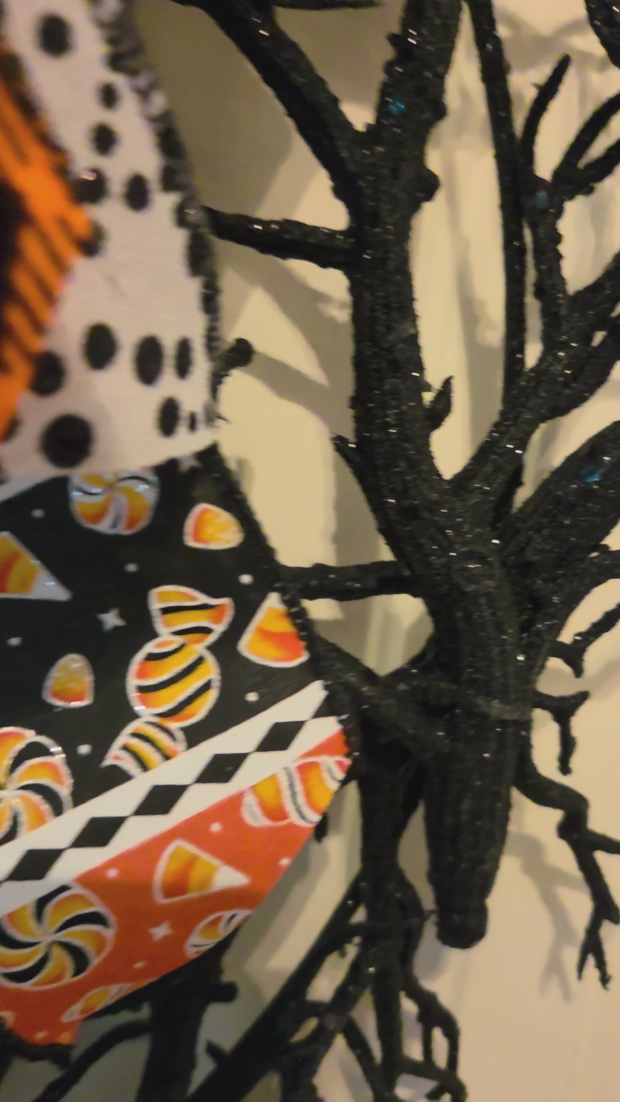 Video showing the Tricks & Treats Halloween wreath, black branch base, and playful layered bow from multiple angles.