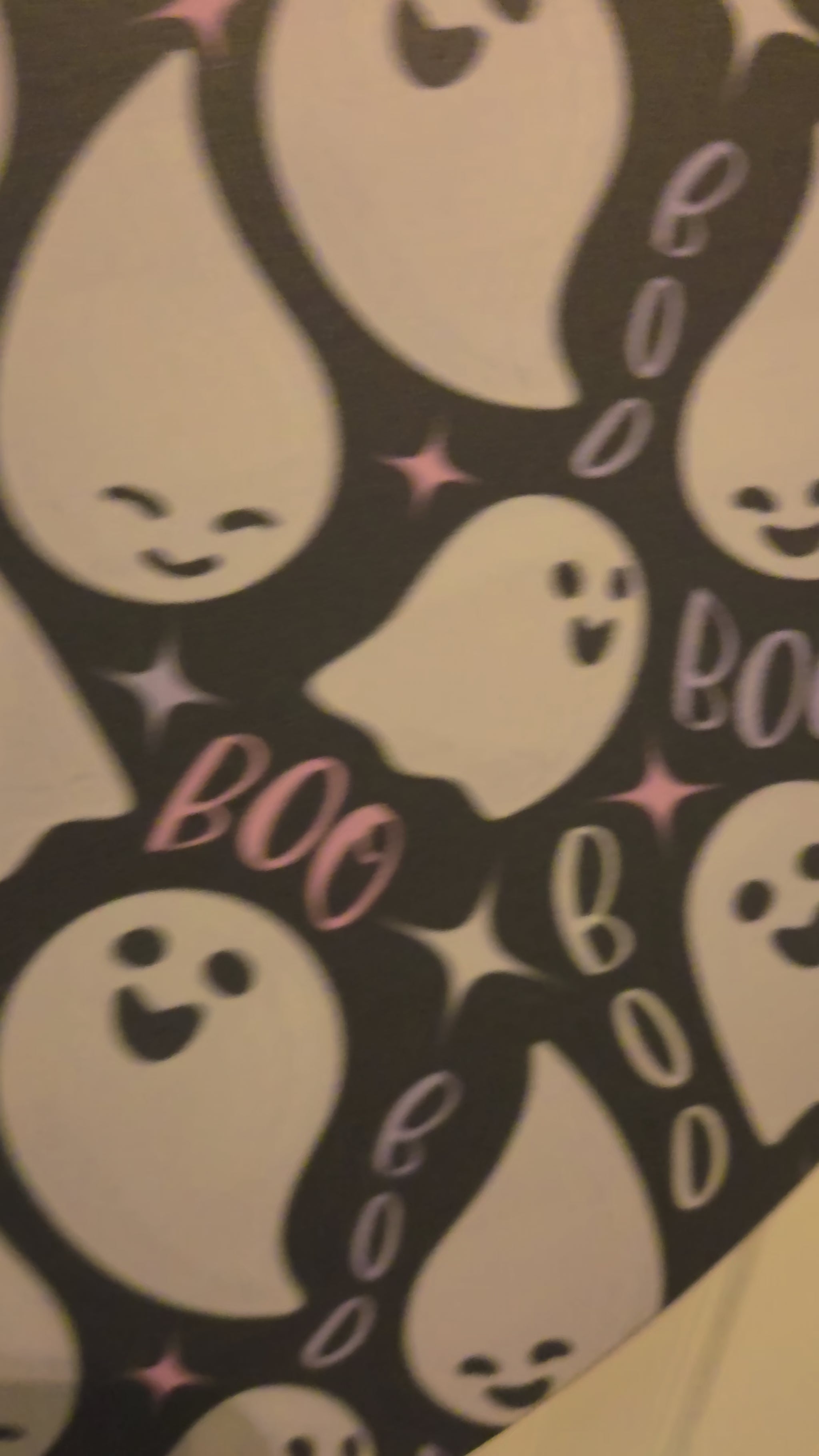 Video showing the Pink Polka Boo door hanger, birch wood construction, Hey Boo ghost design, layered plaid bow, and black ribbon loop.